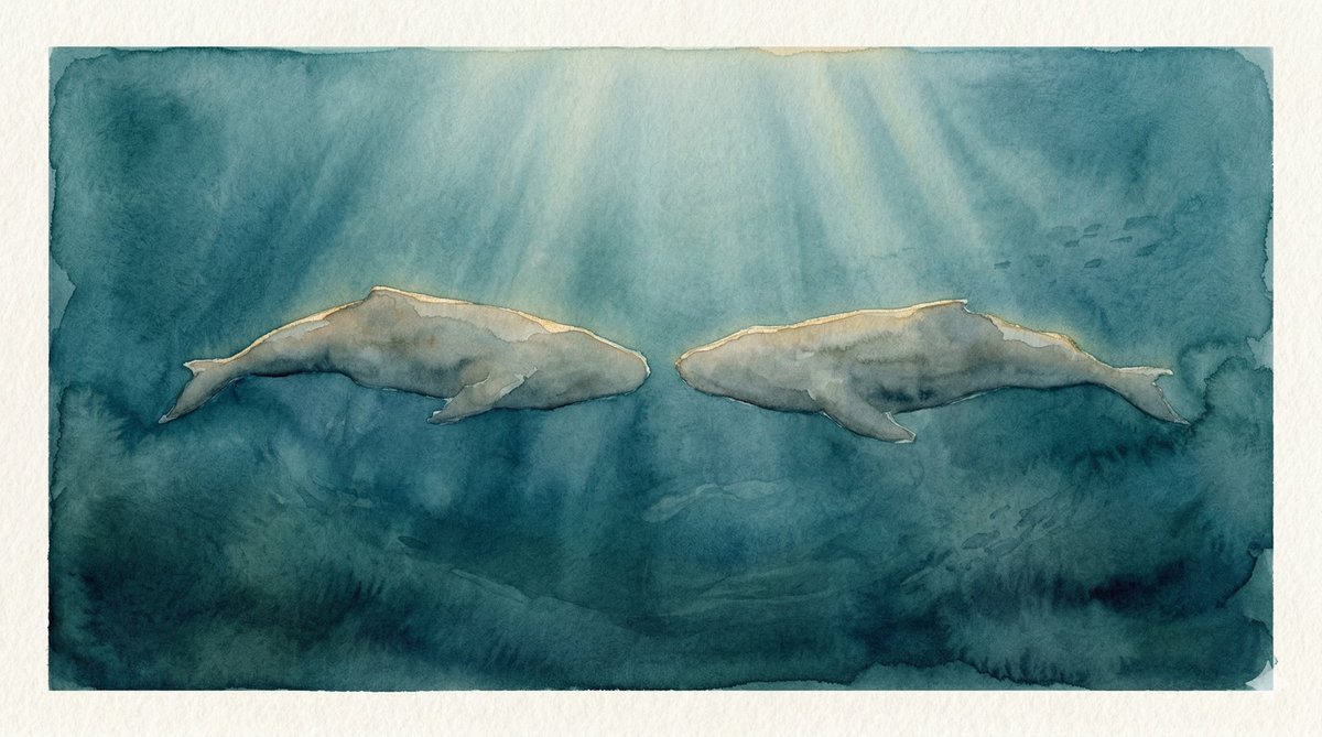 Two large forms moving together through deep blue-green water, golden light filtering from above